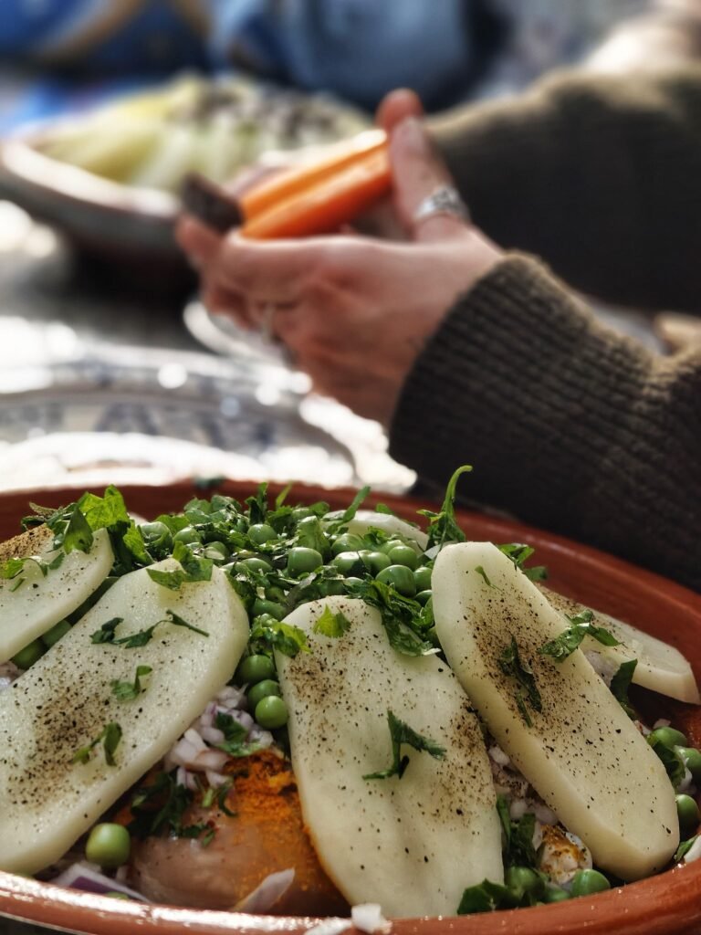 Authentic Moroccan tagine being cooked during a local cooking class in Essaouira