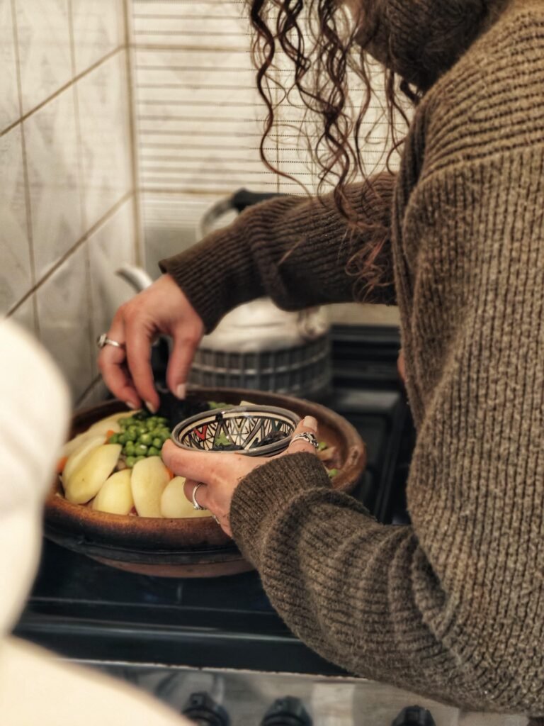 Authentic Moroccan tagine being cooked during a local cooking class in Essaouira